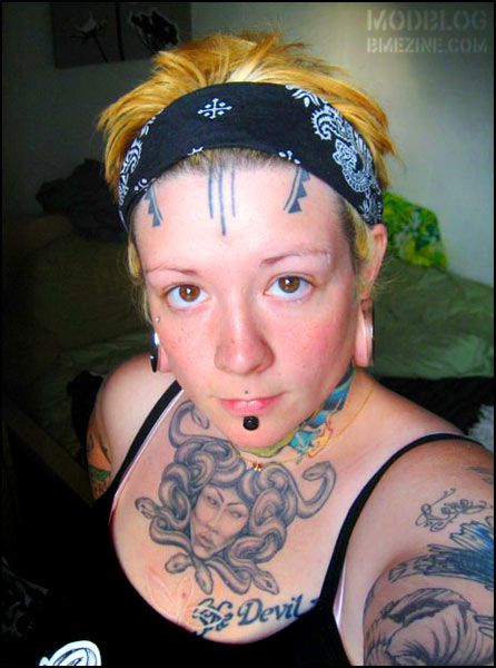 Medusa Face Tattoo On Girl Chest