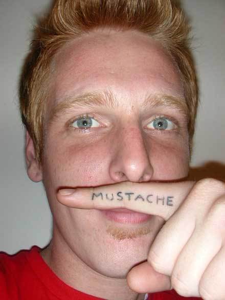 Mustache Lettering Tattoo On Finger