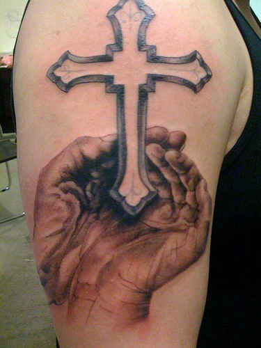 Open praying hands with cross tattoo on half sleeve