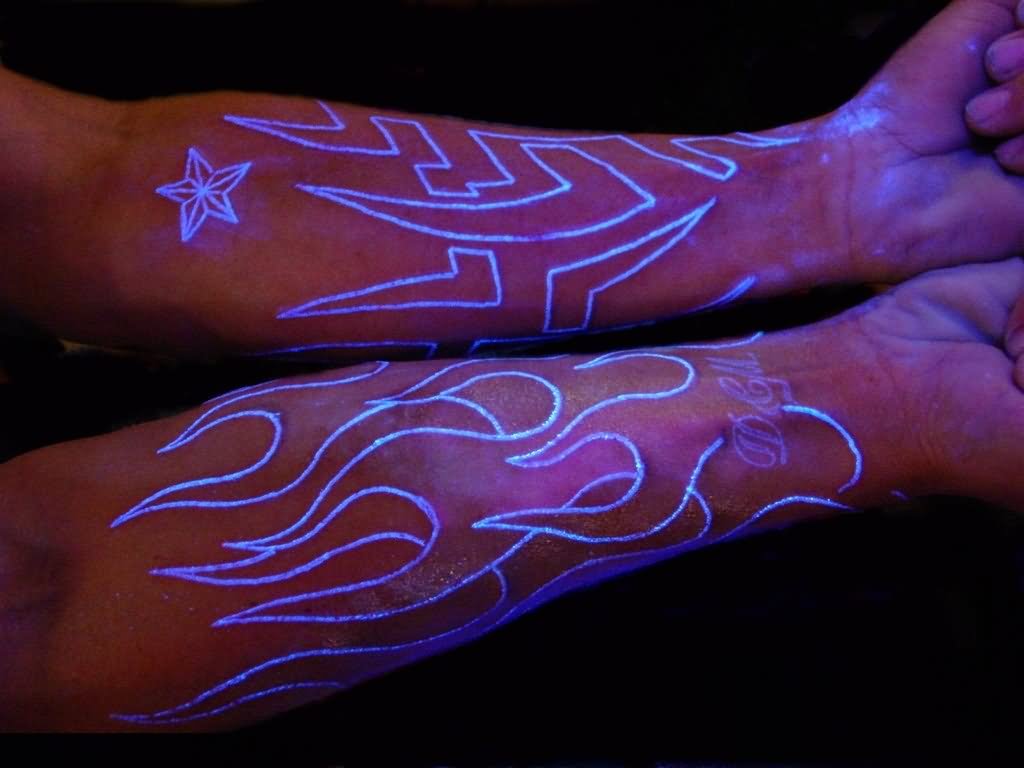 Outline Tribal White Ink Tattoos On Arm Under Black Light