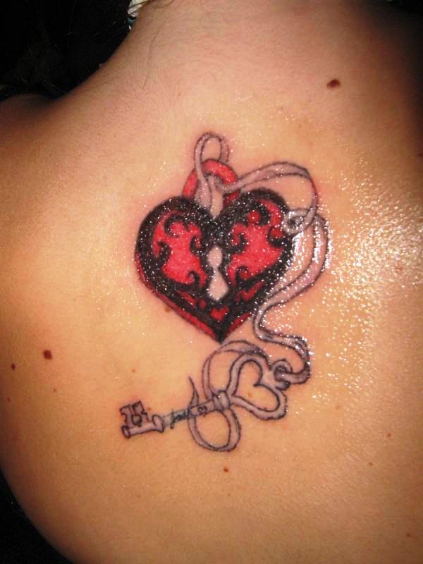 Pink And Black Heart Shape Lock And Key Tattoo On Upper Back By Josh Clinton