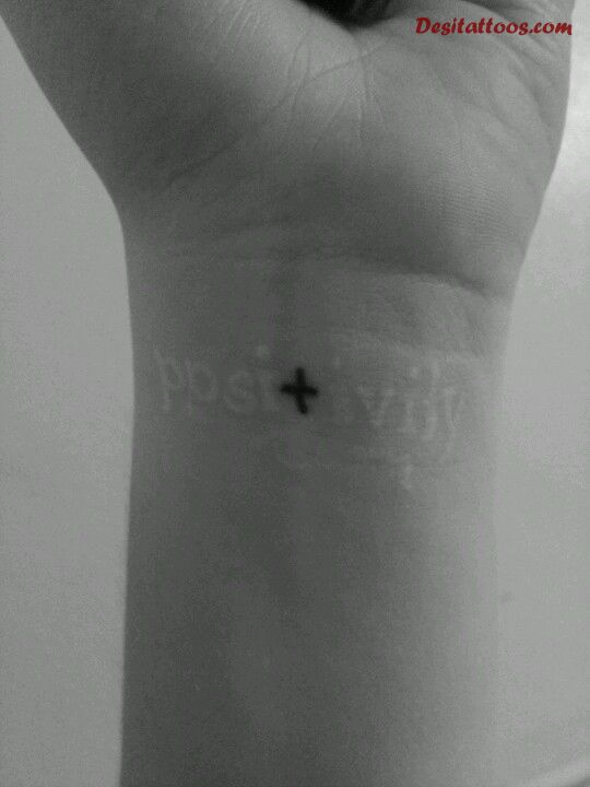 Positivity White Ink Tattoo On Wrist