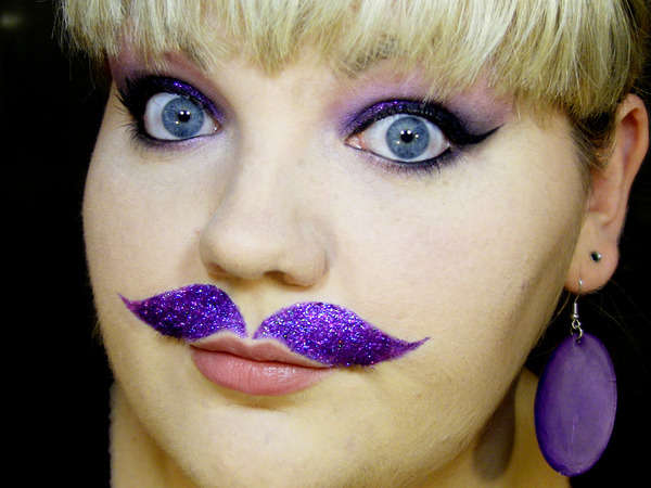 Purple Ink Mustache Tattoo On Girl Upper Lip
