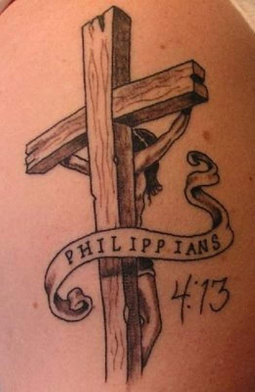 Rear view of Jesus crucifixion and cross tattoo