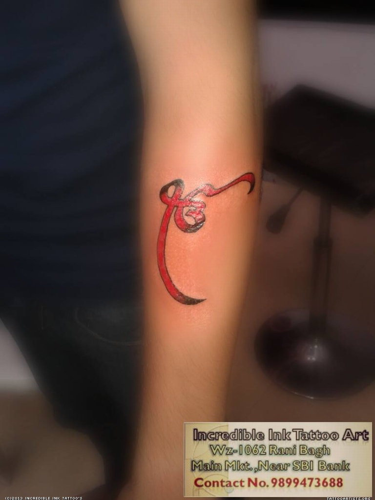Red And Black Ek Onkar Tattoo On Forearm