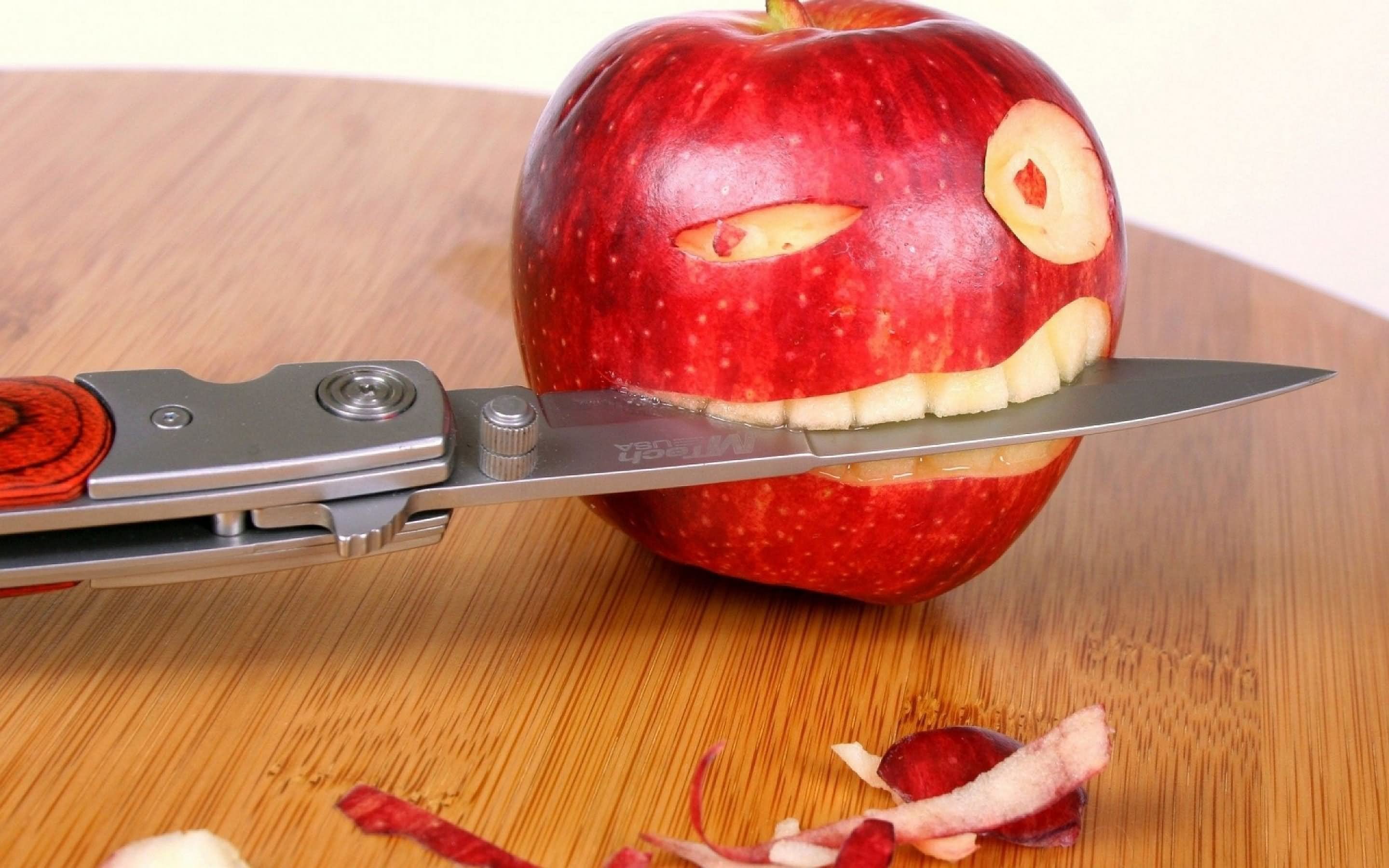 Red Apple Biting Knife Funny Picture