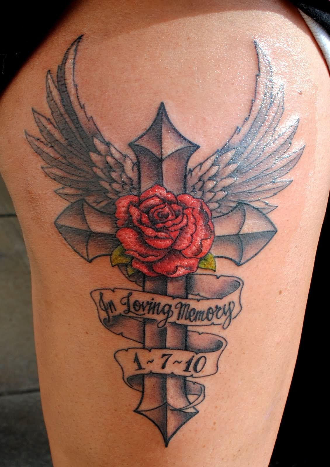 Red rose and banner In loving memory over Black cross with angel wings memorial tattoo on thigh