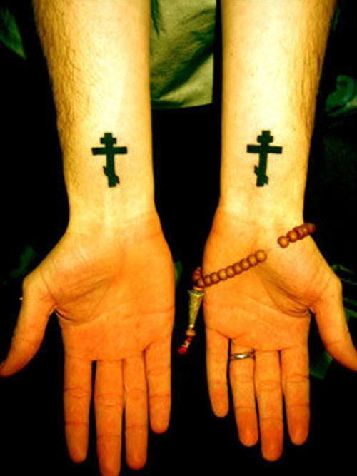 Silhouette Cross Tattoos on wrists