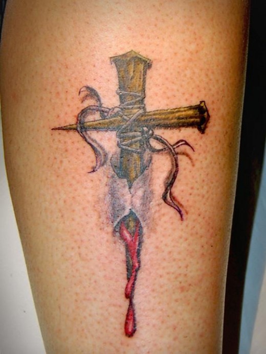 Torn skin nail cross tattoo by carobni
