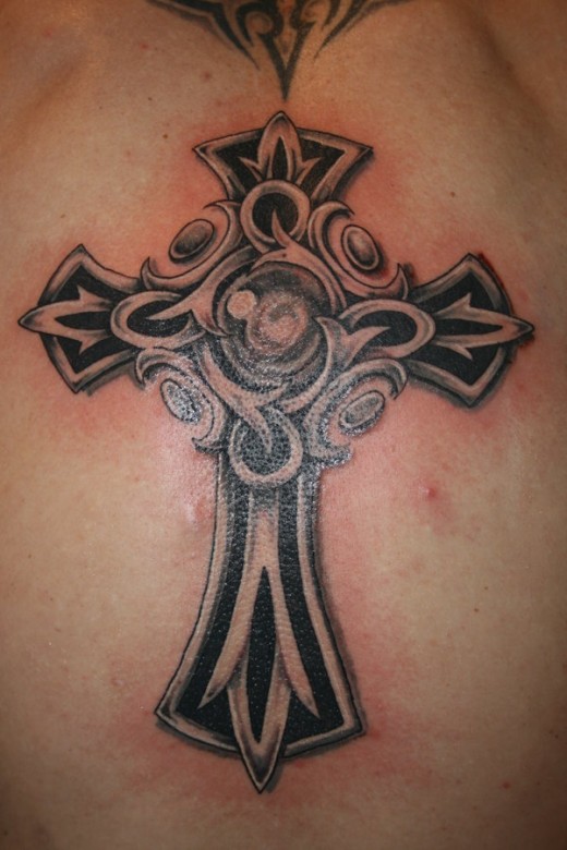 Tribal floral cross tattoo design for back
