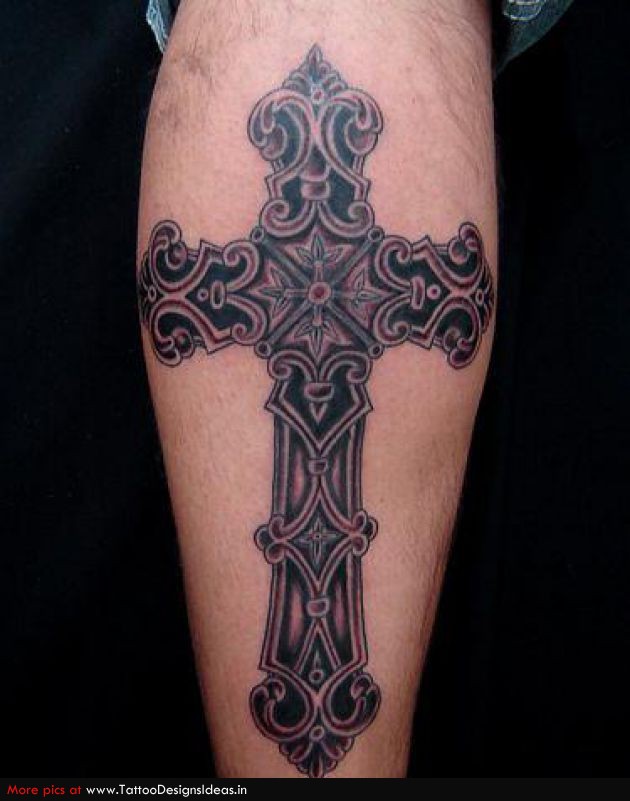 Vintage style black cross tattoo on forearm