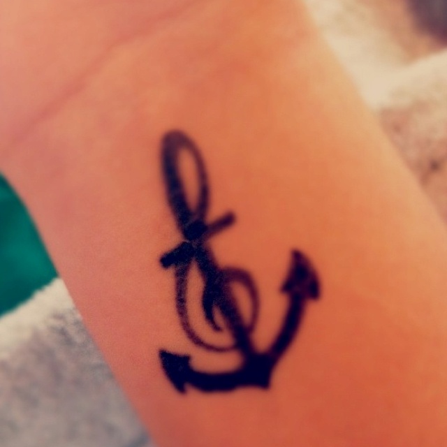Violin Key With Black Anchor Tattoo On Wrist