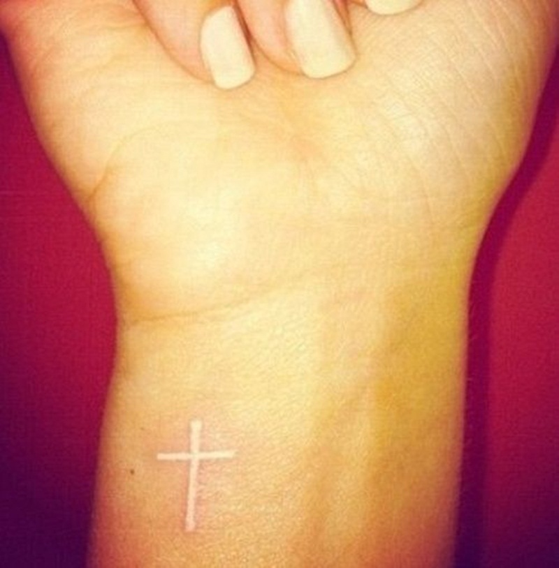 White Ink Cross Tattoo On Right Wrist