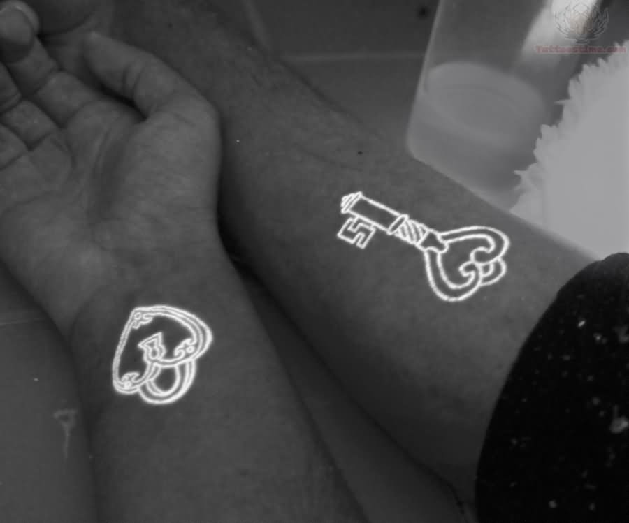 White Ink Heart Shape Lock And key Tattoo On Couple Wrist By Sarah