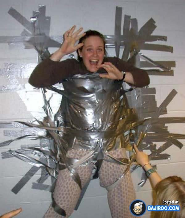 Woman Fixed On Wall With Duct Tape Funny Picture