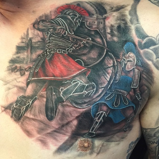 Achilles Fighting Tattoo On Man Chest.