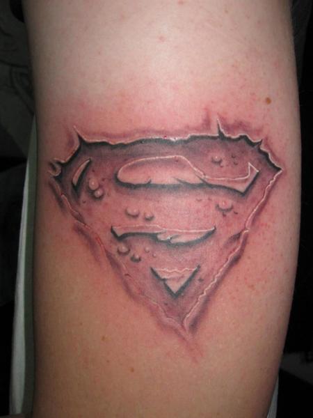 Amazing Ripped Skin Superman Logo Tattoo Design For Arm By Shogun Tats