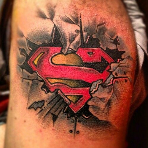 Awesome Ripped Skin Superman Logo Tattoo Design For Shoulder