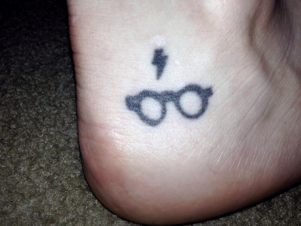 Black Harry Potter Specs With Thunderbolt Symbol Tattoo On Achilles