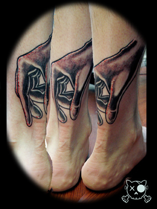 Black Ink Hand Tattoo On Achilles