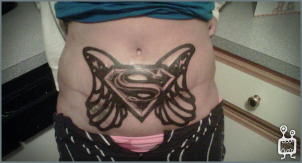 Black Ink Superman Logo With Wings Tattoo On Stomach