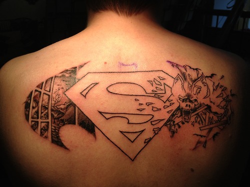 Black Outline Superman Logo Tattoo On Man Upper Back