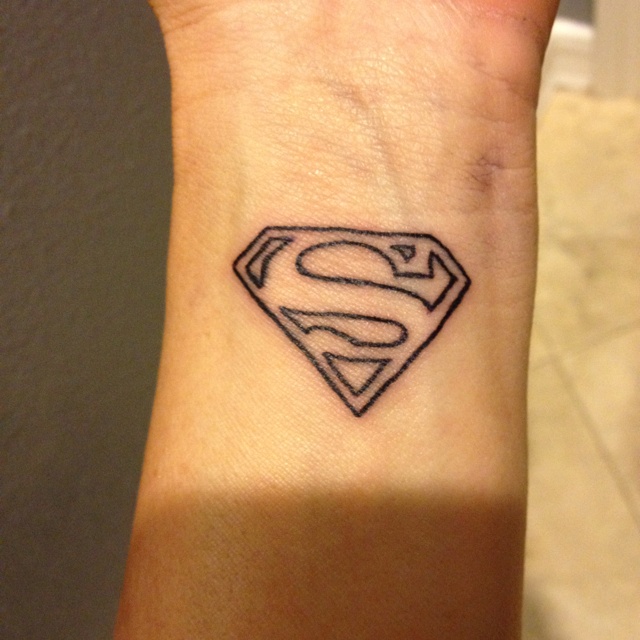 Black Outline Superman Logo Tattoo On Wrist