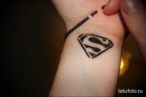 Black Superman Logo Tattoo On Wrist