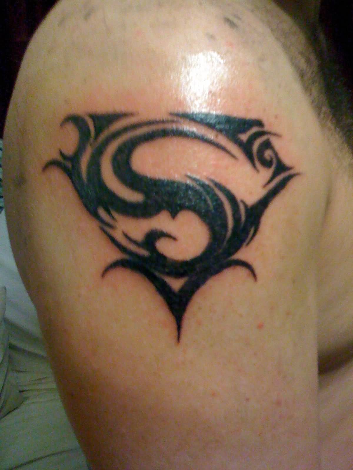 Black Tribal Superman Logo Tattoo On Man Right Shoulder