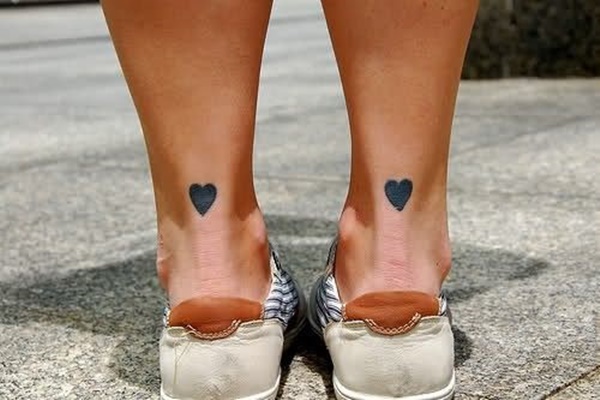 Black Two Heart Tattoo On Both Achilles