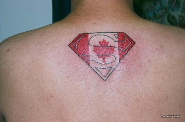 Canada Flag In Superman Logo Tattoo On Upper Back