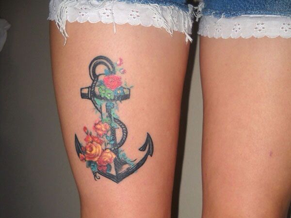Color Flowers And Anchor Tattoo On Girl Thigh