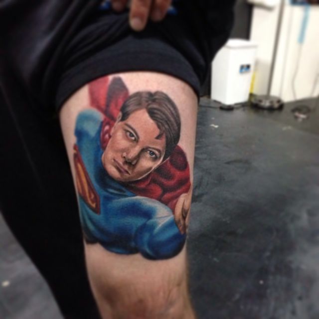Colorful Superman Tattoo On Thigh.