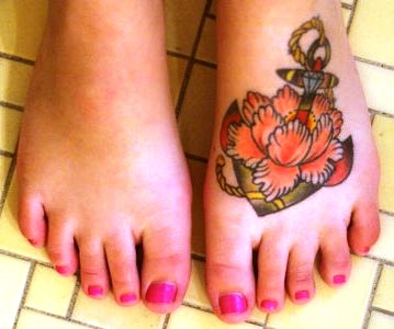 Flower And Anchor Tattoo On Left Foot