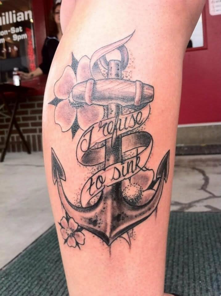 Flower With Banner And Anchor Tattoo On Thigh