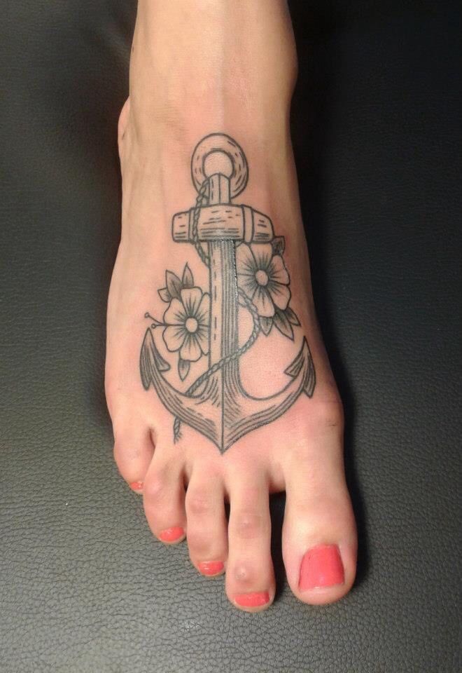 Grey Ink Flowers And Anchor Tattoo On Foot