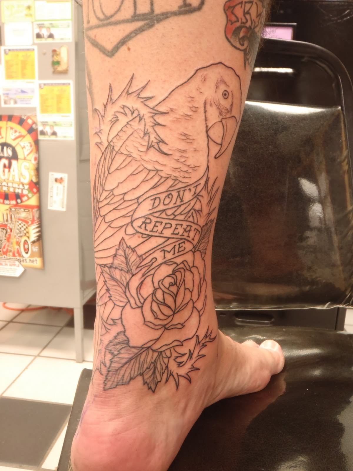 Parrot With Rose And Banner Tattoo On Achilles