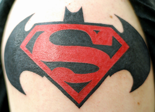Red And Black Superman Logo And Batman Logo Tattoo Design For Shoulder