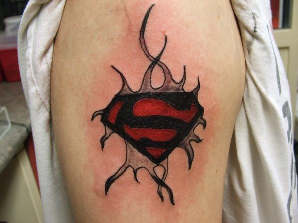 Red And Black Superman Logo Tattoo On Right Shoulder By Robert