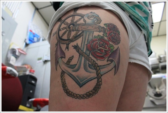 Red Rose Flowers and Anchor Tattoo On Girl Thigh