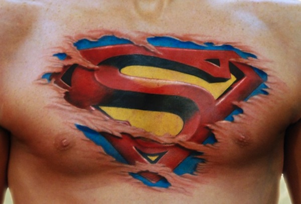 Ripped Skin Superman Logo Tattoo On Man Chest