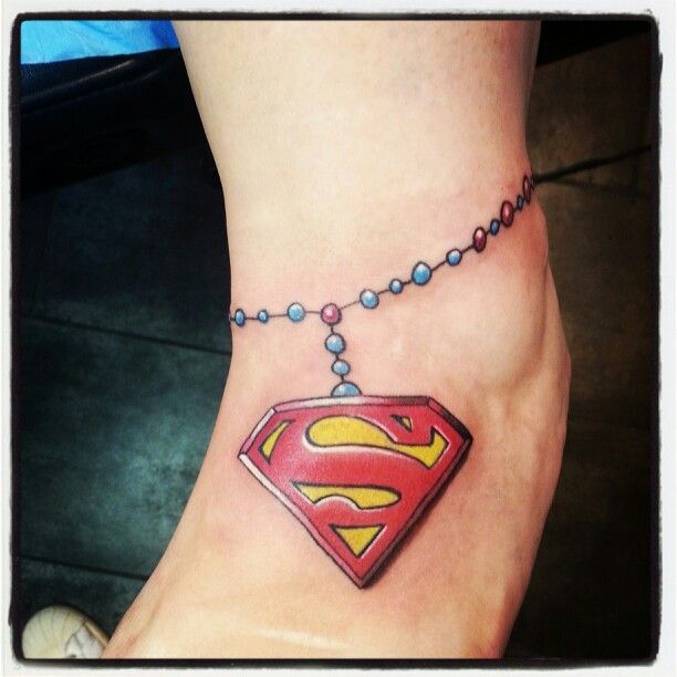 Rosary Superman Logo Tattoo On Foot