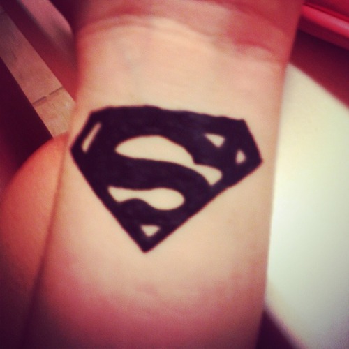 Silhouette Superman Logo Tattoo On Wrist