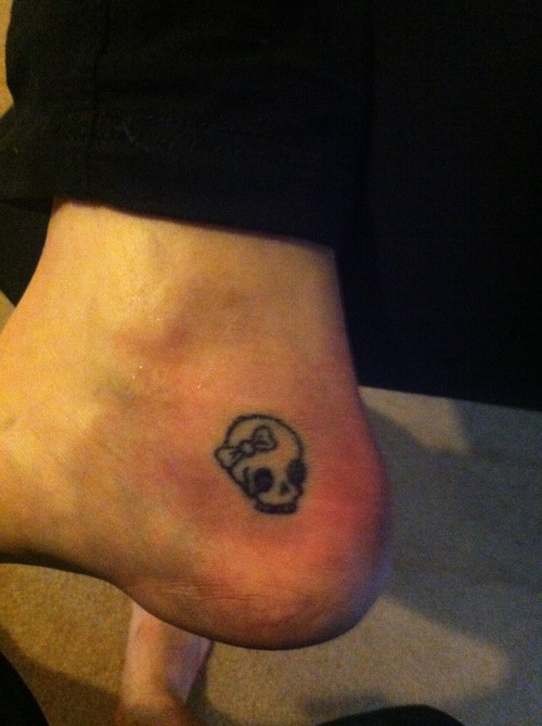 Skull With Bow Tattoo On Achilles