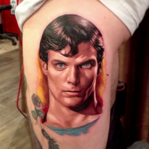 Superman Face Tattoo On Side Thigh By Joe Carpenter