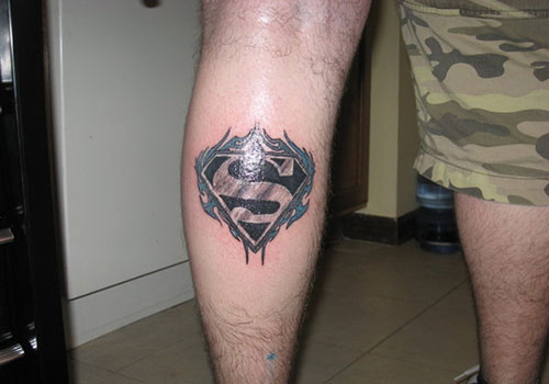 Superman Logo In Flame Tattoo On Leg Calf By Kevin