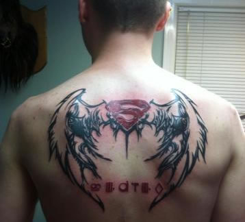 Superman Logo With Wings Tattoo On Man Upper Back