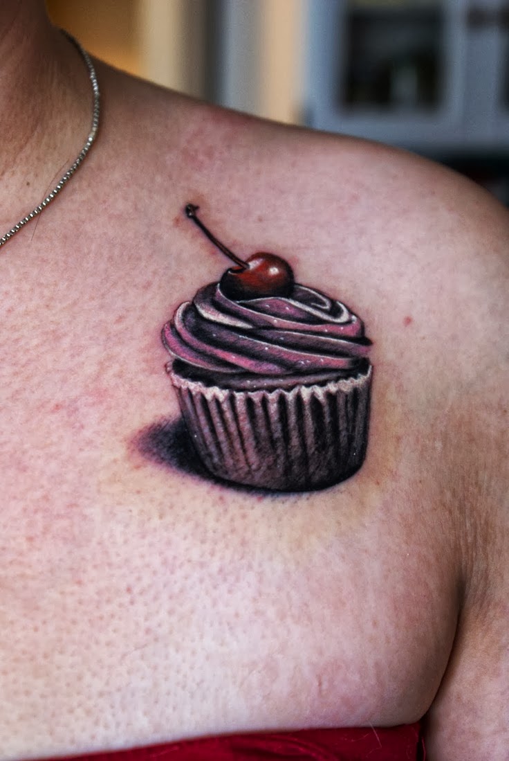 3D Cupcake Tattoo On Girl Left Front Shoulder