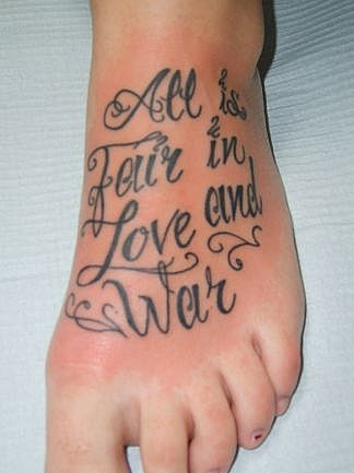 All Is Fair In Love And War Lettering Tattoo On Foot