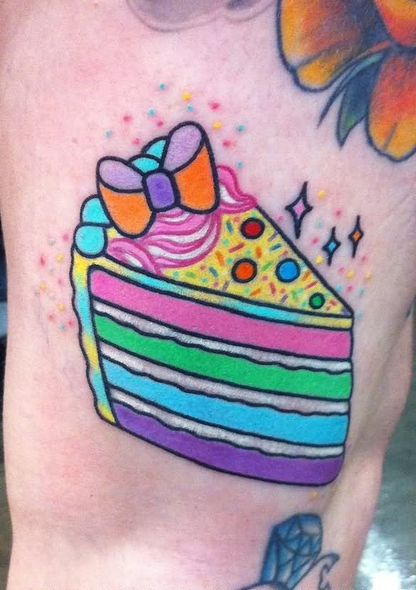Amazing Colorful Cupcake With Bow Tattoo Design